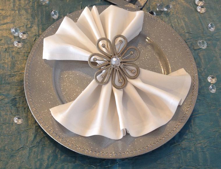 Chargers, napkin holders, and decor props for reception tables