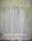 Flower Wall backdrop with white drape